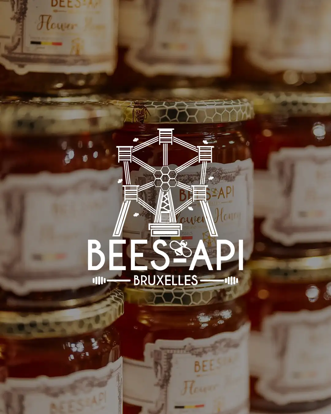 Jars of honey and the Bees-Api logo at Marché Saint-Géry